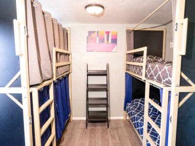 shared-dorm-room-with-bunk-beds-and-privacy-curtains-at-california-dreams-hostel-ocean-beach