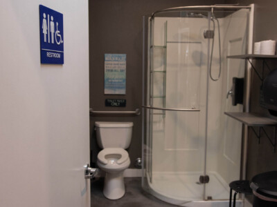 Accessible restroom with private shower at California Dreams Hostel in San Diego